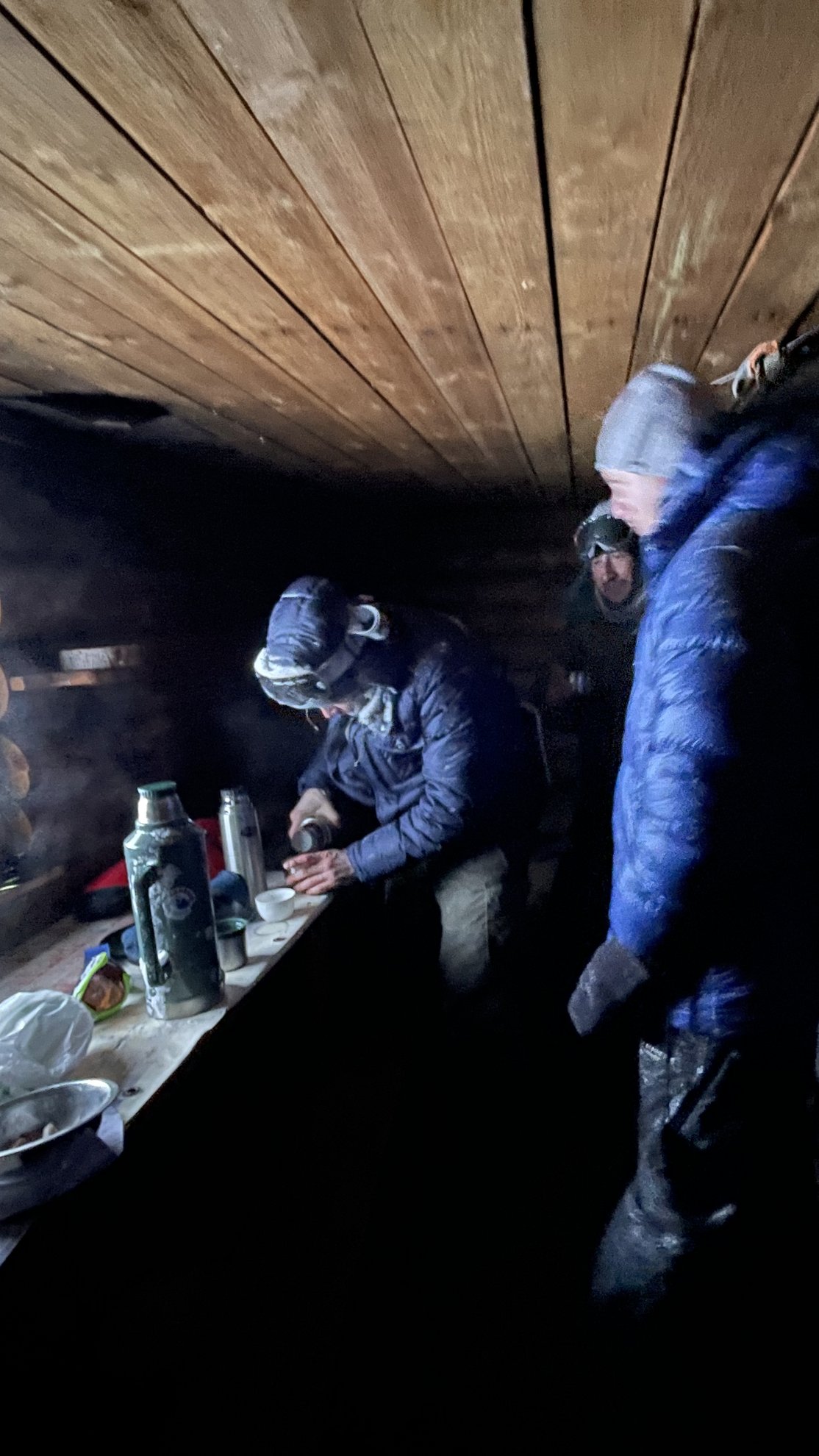 inside a cold izba at Baza Iliycha with tea and food