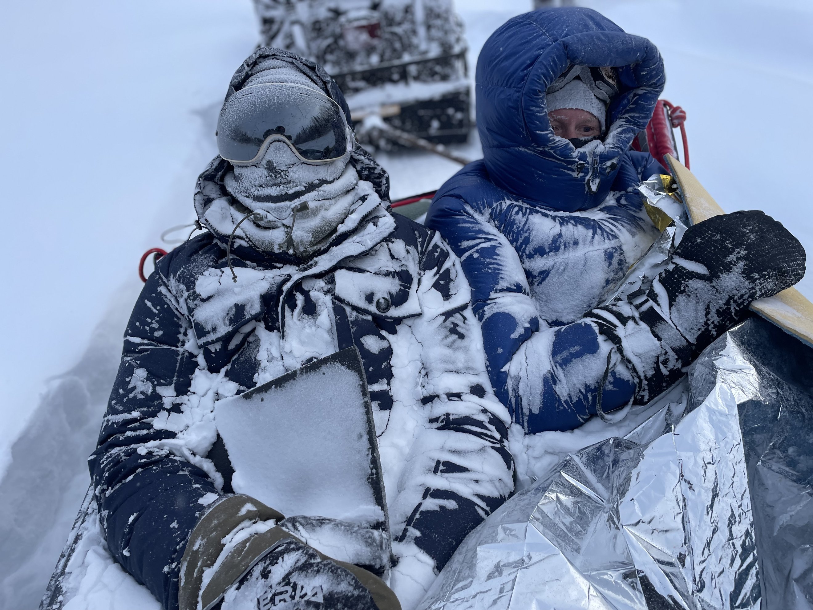 clothing and ski glasses covered in snow