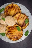 top down view of pineapple slices and ice cream scoops