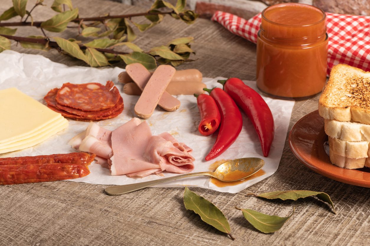 Deconstructed ingredients of the sandwich laid out on parchment paper