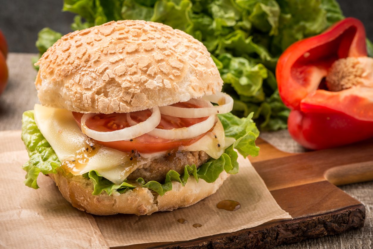 Close-up shot of the burger on brown paper