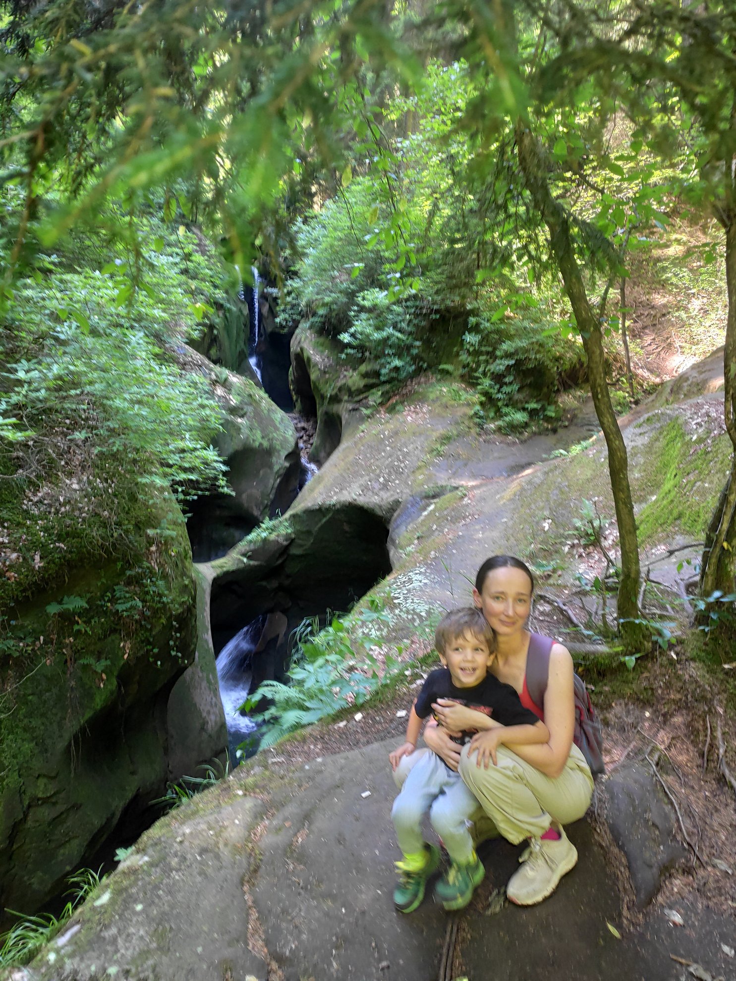 Tight canyon walls with a waterfall in the background