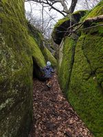 narrow passage between moss covered rocks