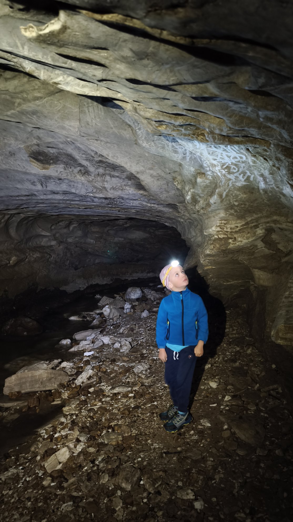 interior view of the cave ceiling and rocky ground