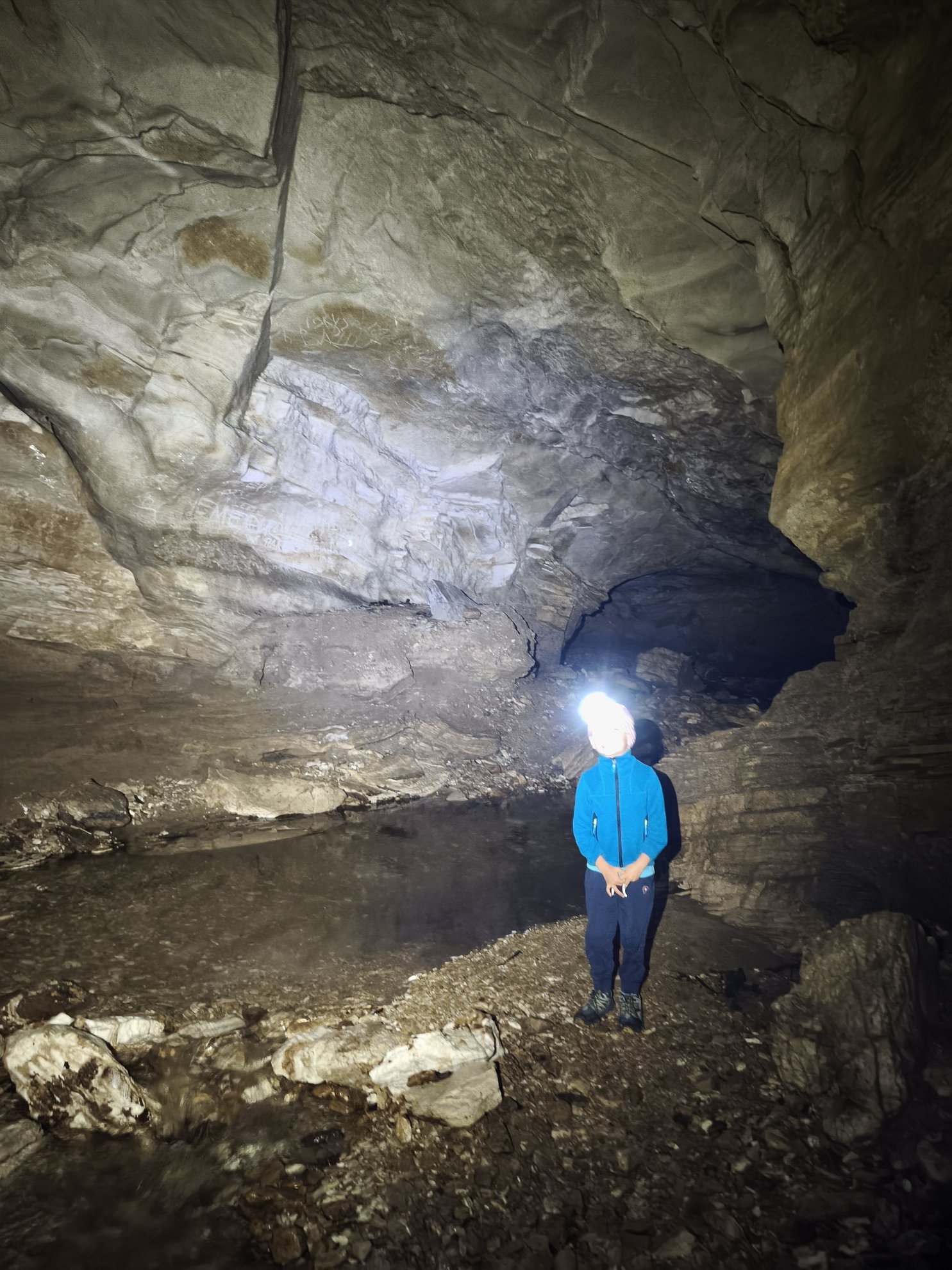 Interior view of the cave with a creek on the floor
