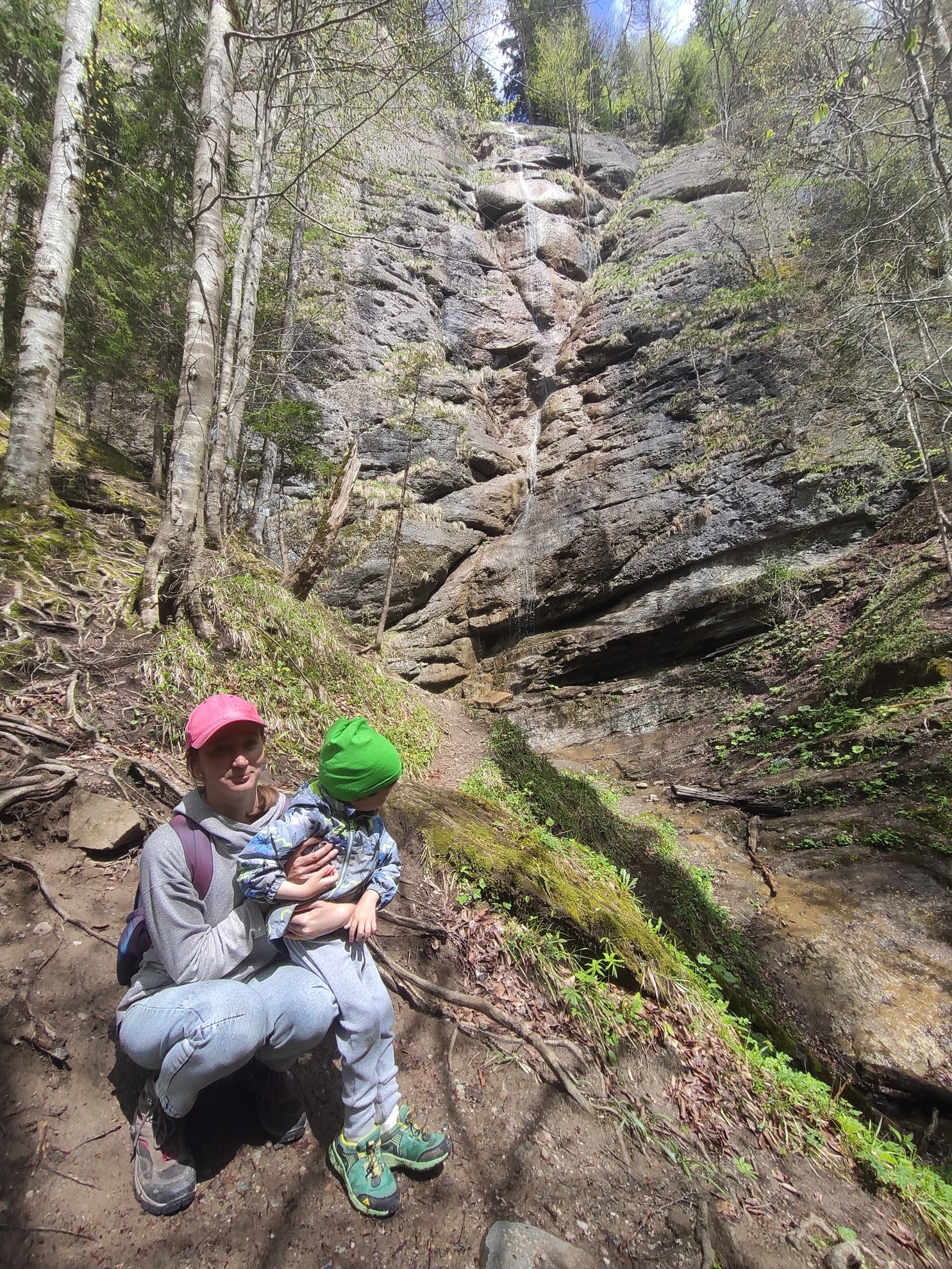 low angle view of the waterfall and rock face